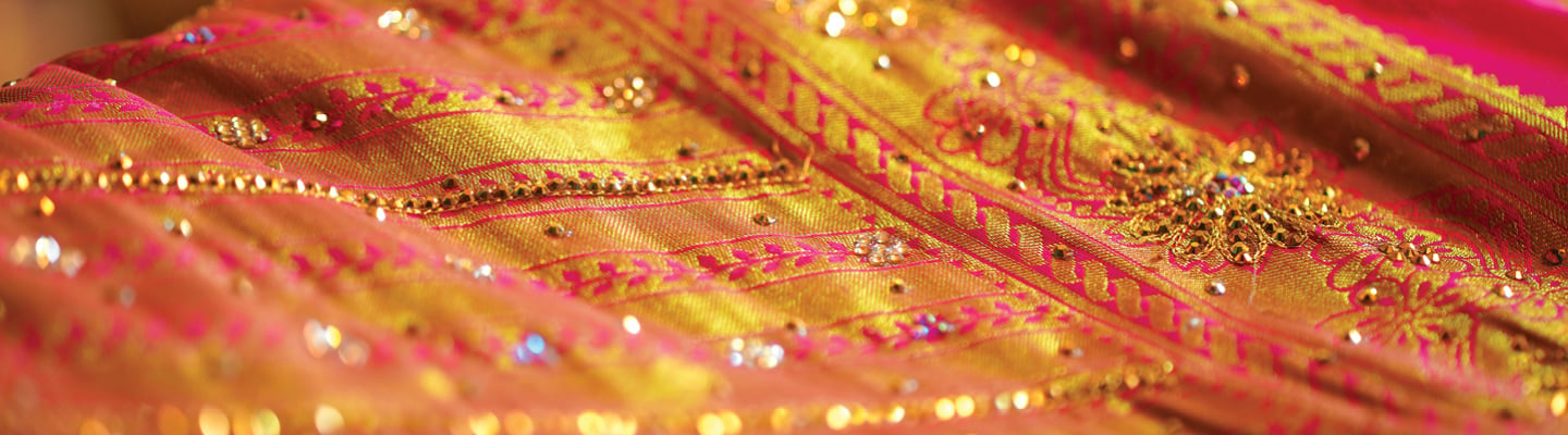 Beaded Indian textile in shades of yellow and fuchsia 