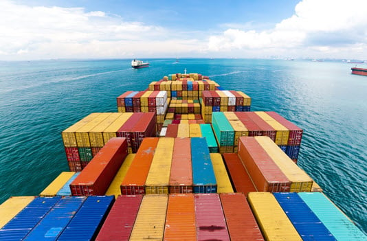 colorful shipping containers open sea